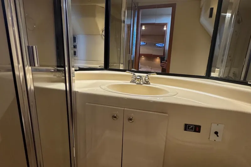 Slide: The Image of Bathroom interior of 2004 Meridian 490 Pilothouse yacht with sink and mirror. - 19