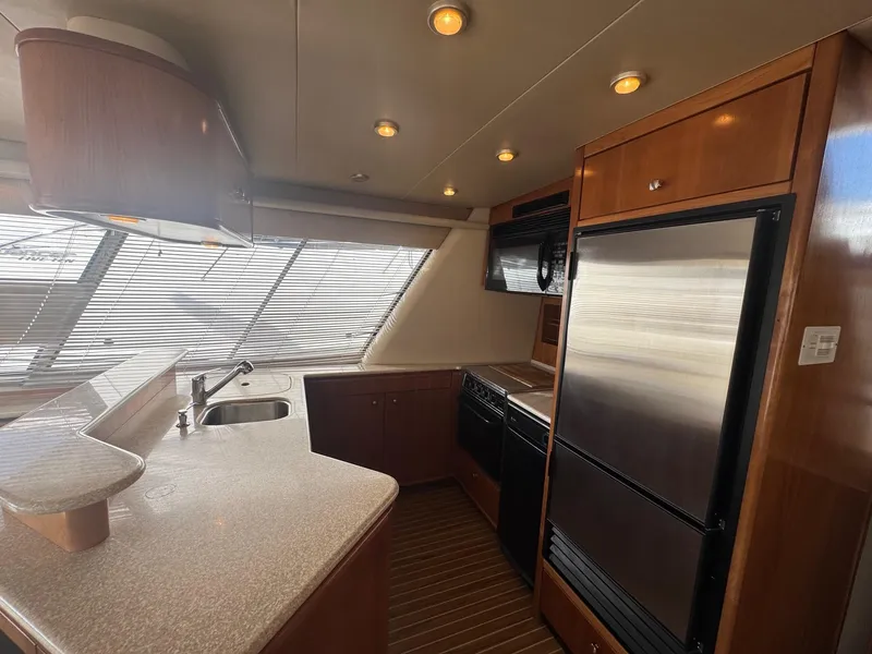 Slide: The Image of Luxurious kitchen interior of 2004 Meridian 490 Pilothouse yacht with modern appliances. - 9