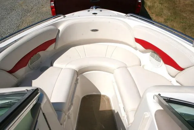 Slide: The Image of Interior view of a 2000 Chaparral 186 SSi boat with white and red seating. - 11