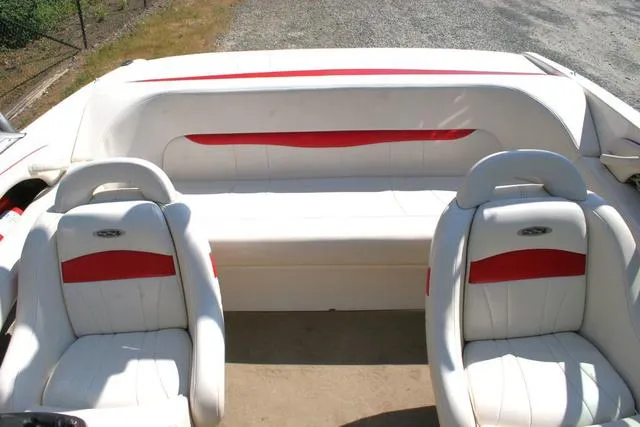 Slide: The Image of 2000 Chaparral 186 SSi boat interior with white and red seating, viewed from above. - 13