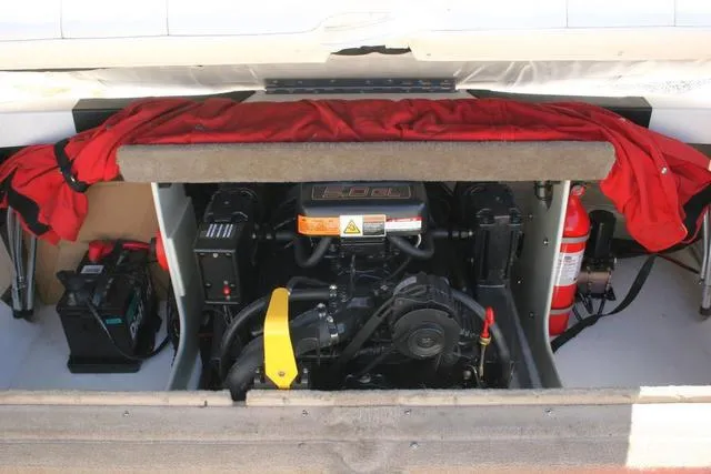 Slide: The Image of Engine compartment of 2000 Chaparral 186 SSi boat with visible battery and fire extinguisher. - 14