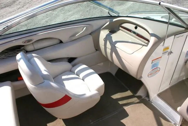 Slide: The Image of 2000 Chaparral 186 SSi boat interior with white seating and dashboard. - 7
