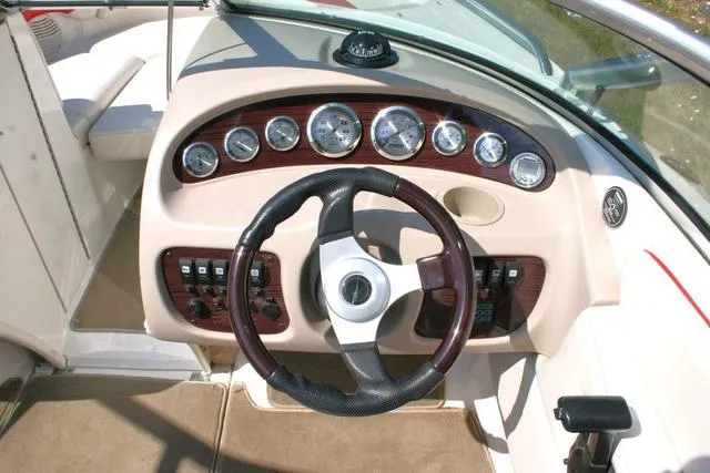 Slide: The Image of Dashboard of a 2000 Chaparral 186 SSi boat with gauges and steering wheel. - 8
