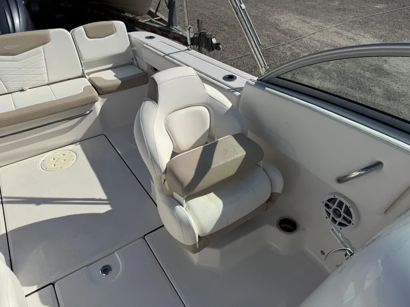 Slide: The Image of 2024 Robalo R207 Dual Console boat interior with white seating and modern design. - 16