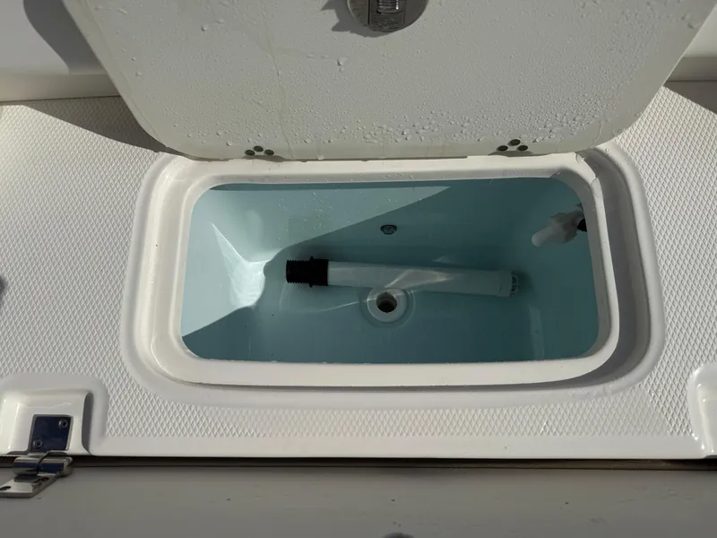 Slide: The Image of Livewell compartment on 2024 Robalo R207 Dual Console boat. - 19