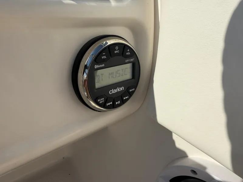 Slide: The Image of Clarion audio system in 2024 Robalo R207 Dual Console boat. - 25