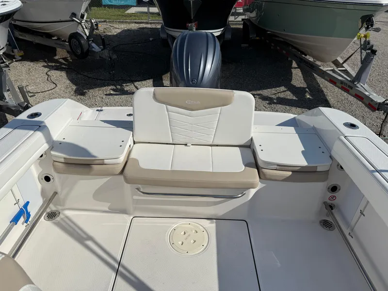 Slide: The Image of 2024 Robalo R207 Dual Console boat interior with seating and storage compartments. - 31