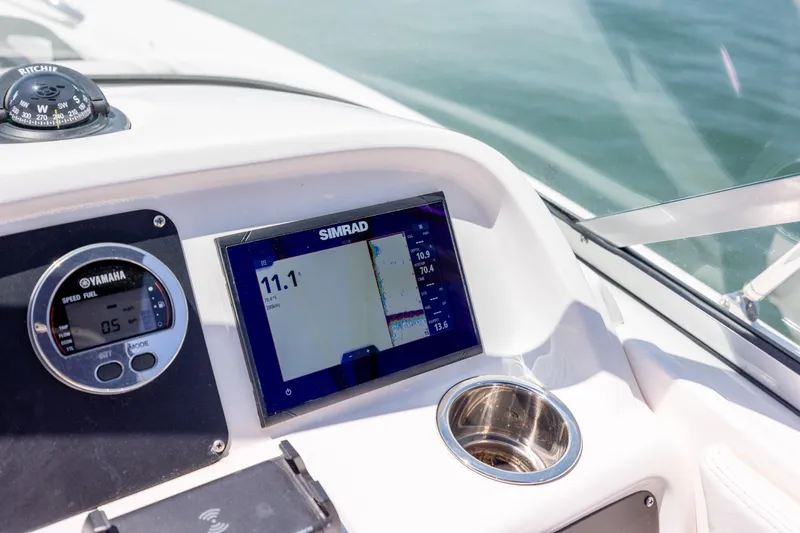 Slide: The Image of Dashboard of 2024 Robalo R207 Dual Console with Simrad display and Yamaha gauge. - 55