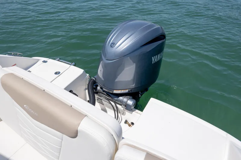 Slide: The Image of 2024 Robalo R207 Dual Console boat with Yamaha outboard engine on water. - 62