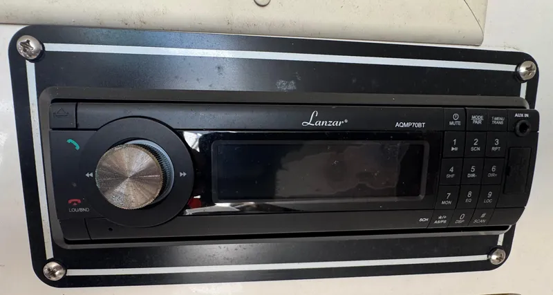 Slide: The Image of Radio system in a 1999 Chaparral 290 Signature Cruiser boat dashboard. - 23