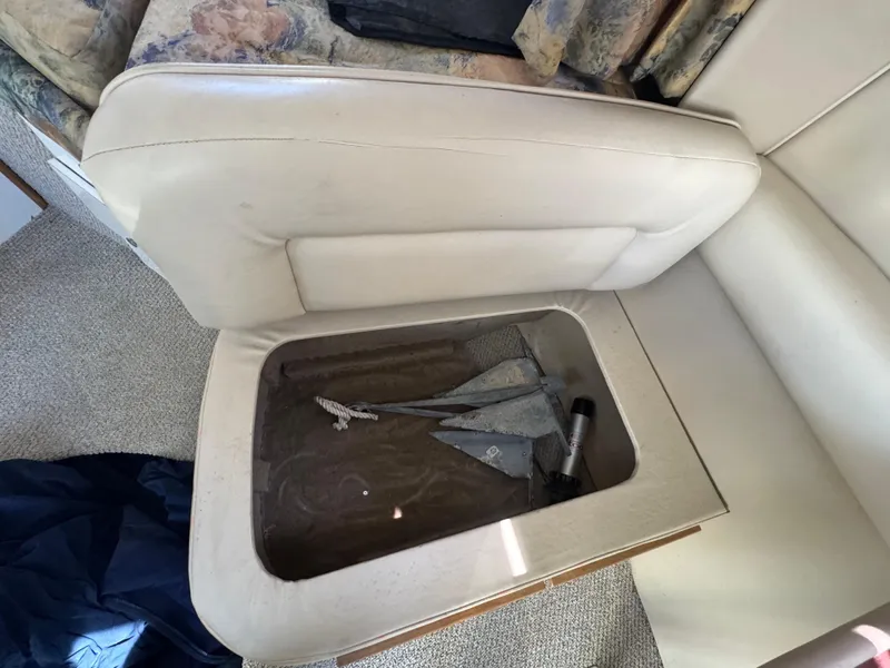 Slide: The Image of 1999 Chaparral 290 Signature Cruiser interior storage compartment with anchor and flashlight. - 44