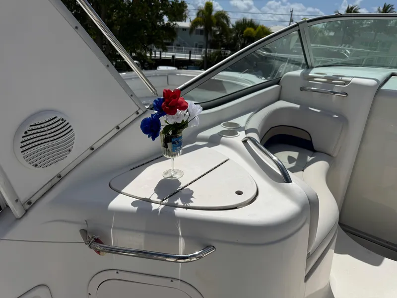 Slide: The Image of 1999 Chaparral 290 Signature Cruiser interior with flowers in a glass vase. - 46