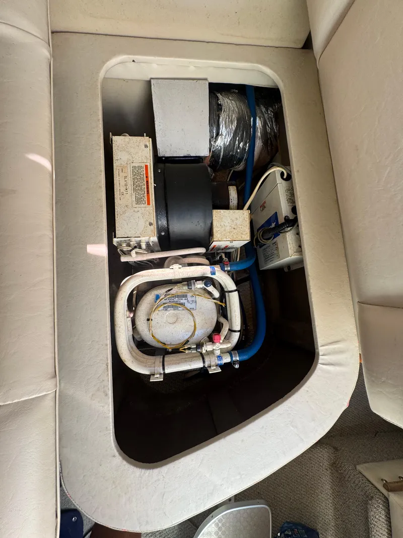 Slide: The Image of 1999 Chaparral 290 Signature Cruiser interior compartment with mechanical components. - 66