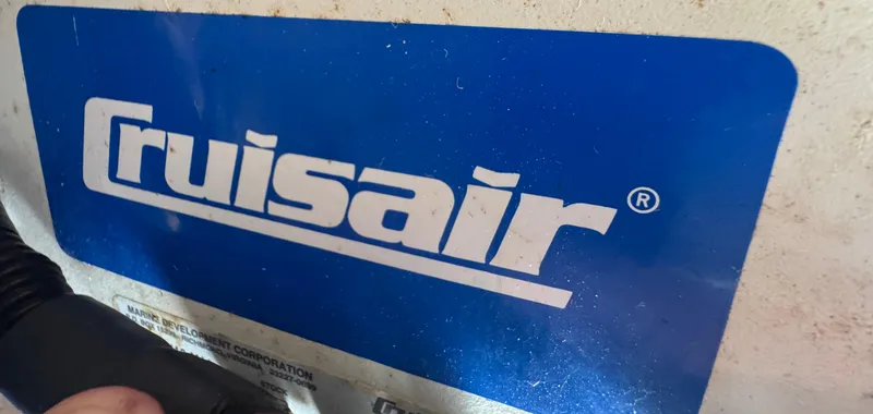 Slide: The Image of 1999 Chaparral 290 Signature Cruiser featuring a Cruisair logo on a blue background. - 76