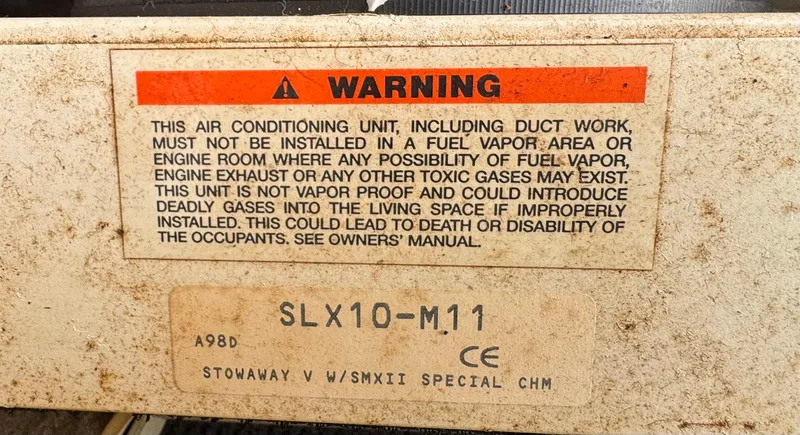 Slide: The Image of Warning label on Chaparral 290 Signature Cruiser air conditioning unit, model SLX10-M11, 1999. - 78