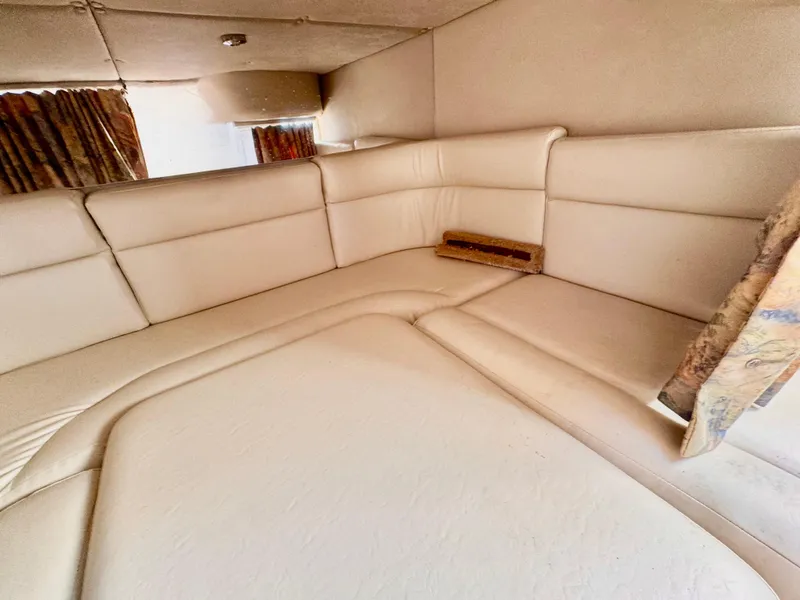 Slide: The Image of Interior cabin of 1999 Chaparral 290 Signature Cruiser with beige seating. - 9