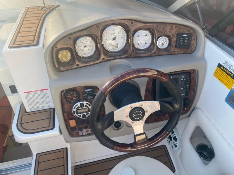 Slide: The Image of Steering wheel and dashboard of 2011 Ebbtide 2700 Cuddy Bow Rider boat. - 17