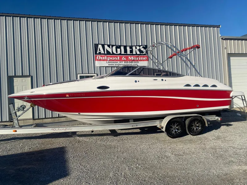 Slide: The Image of 2011 Ebbtide 2700 Cuddy Bow Rider boat on trailer, red and white, at Angler's Outpost & Marine. - 2