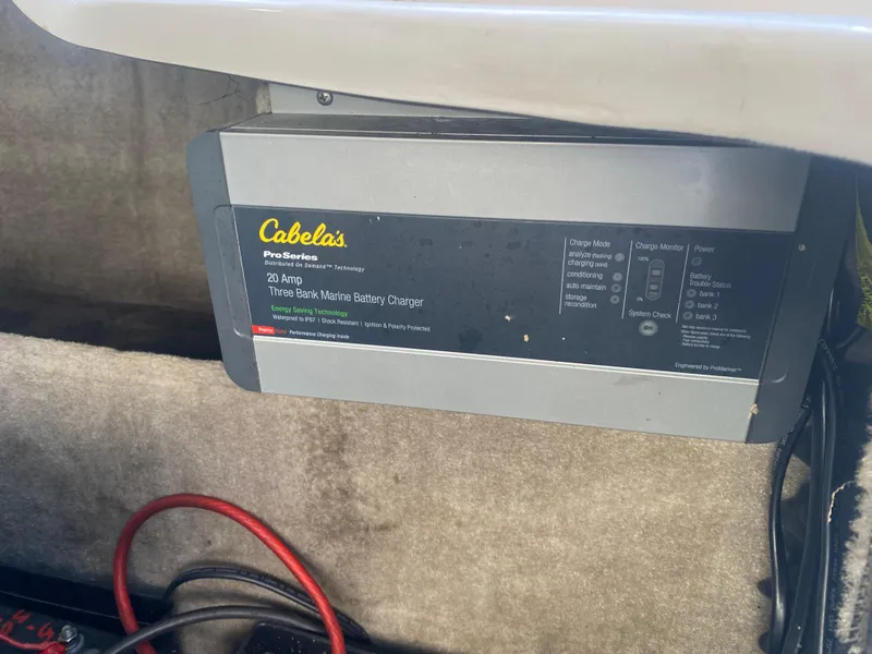 Slide: The Image of Cabela's marine battery charger in 2011 Ebbtide 2700 Cuddy Bow Rider boat. - 4