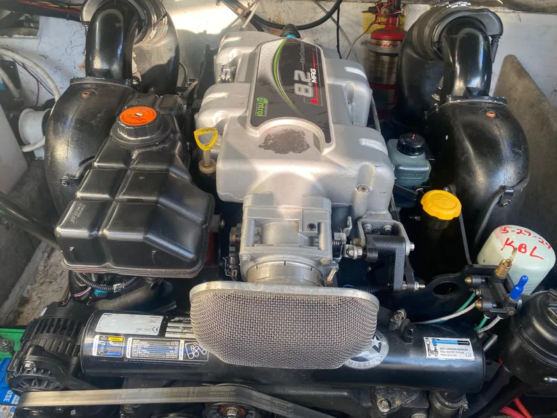 Slide: The Image of Engine of a 2011 Ebbtide 2700 Cuddy Bow Rider boat, detailed view. - 5