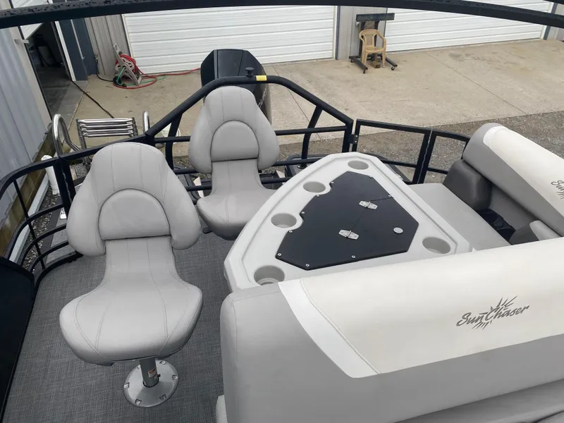 Slide: The Image of 2023 SunChaser Eclipse 8523 SBX boat interior with seating and table. - 16