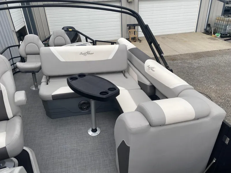 Slide: The Image of 2023 SunChaser Eclipse 8523 SBX pontoon boat interior with gray seating and table. - 18