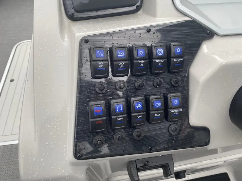 Slide: The Image of Control panel of 2023 SunChaser Eclipse 8523 SBX boat with illuminated switches. - 21