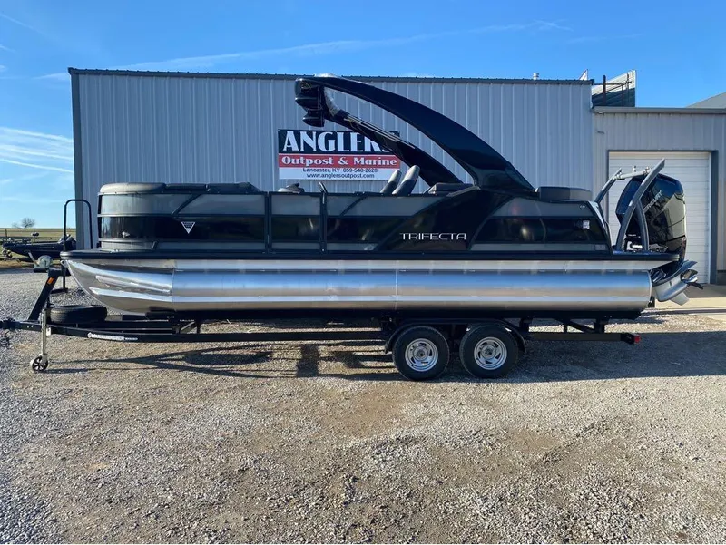 Slide: The Image of 2024 Trifecta 23 RFS 3.0 pontoon boat on trailer at Angler's Outpost. - 1