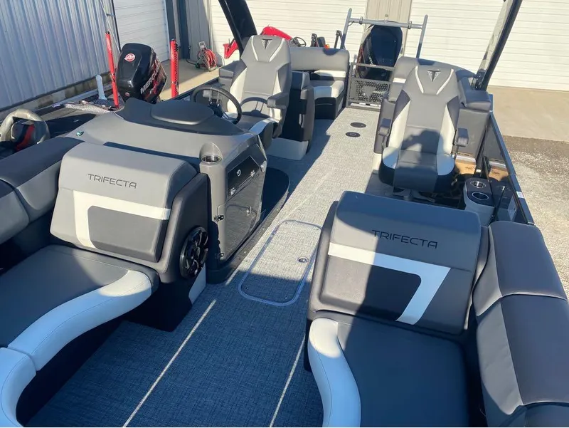 Slide: The Image of 2024 Trifecta 23 RFS 3.0 pontoon boat interior with modern seating and steering console. - 16
