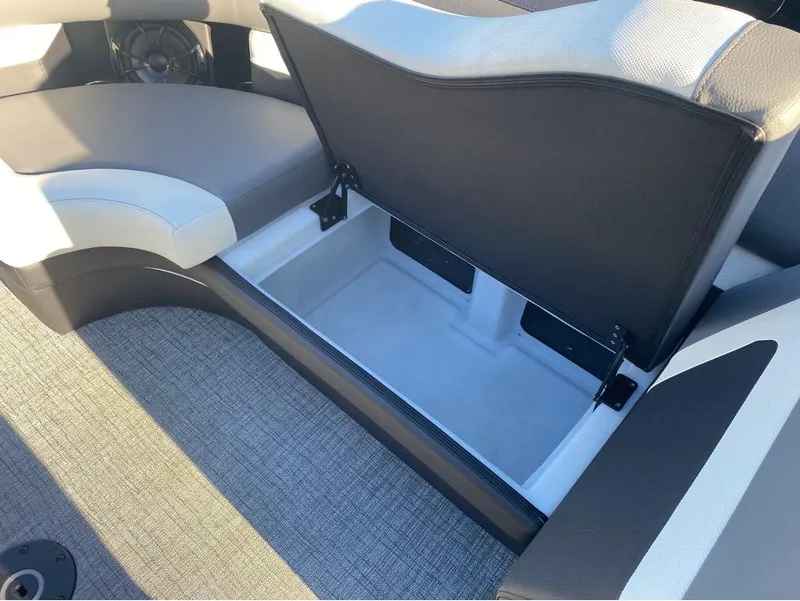 Slide: The Image of 2024 Trifecta 23 RFS 3.0 boat interior with open storage compartment. - 18