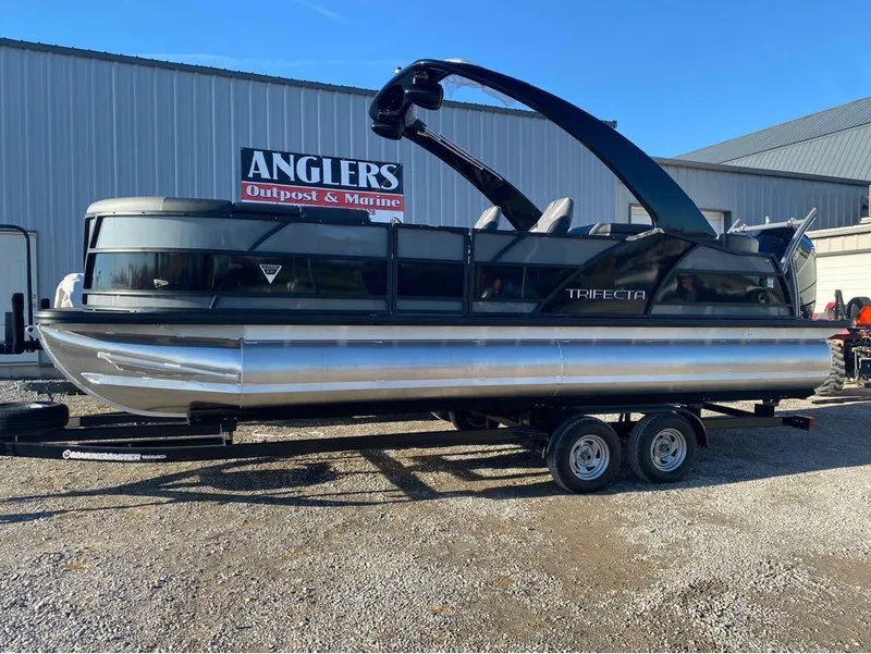 Slide: The Image of 2024 Trifecta 23 RFS 3.0 pontoon boat on trailer at Anglers Outpost & Marine. - 19