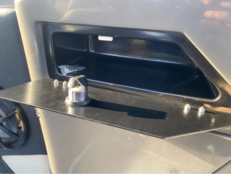 Slide: The Image of 2024 Trifecta 23 RFS 3.0 boat storage compartment with cup holder. - 20