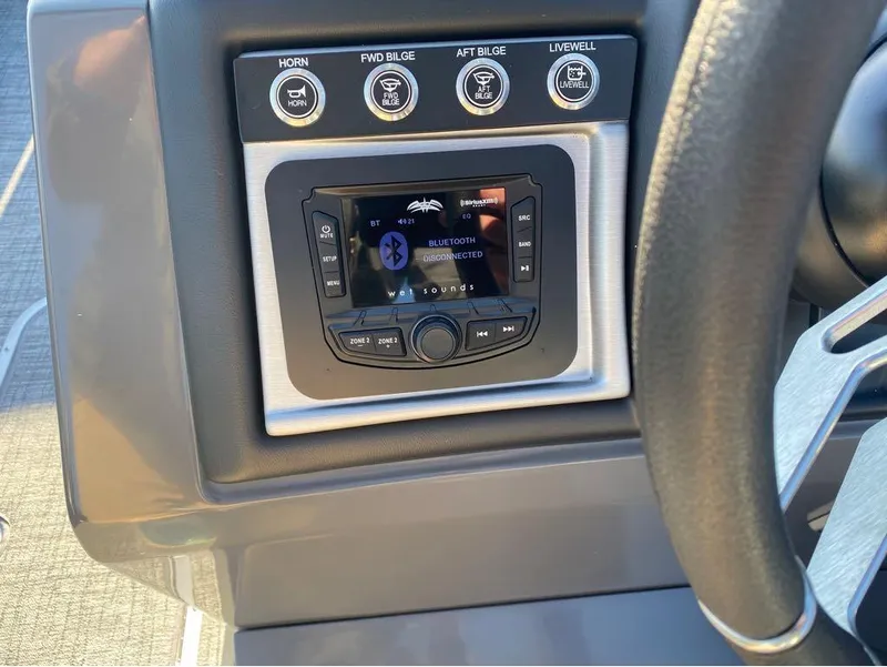 Slide: The Image of 2024 Trifecta 23 RFS 3.0 dashboard with Bluetooth stereo and control buttons. - 22