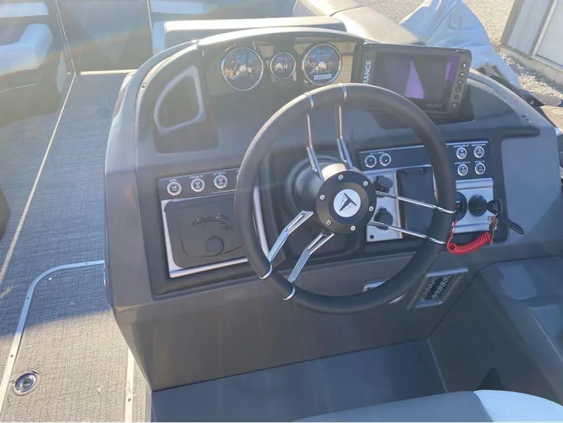 Slide: The Image of 2024 Trifecta 23 RFS 3.0 boat dashboard with steering wheel and control panel. - 28
