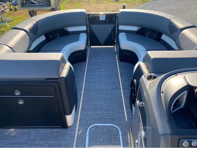 Slide: The Image of 2024 Trifecta 23 RFS 3.0 pontoon boat interior with gray seating and carpet flooring. - 30