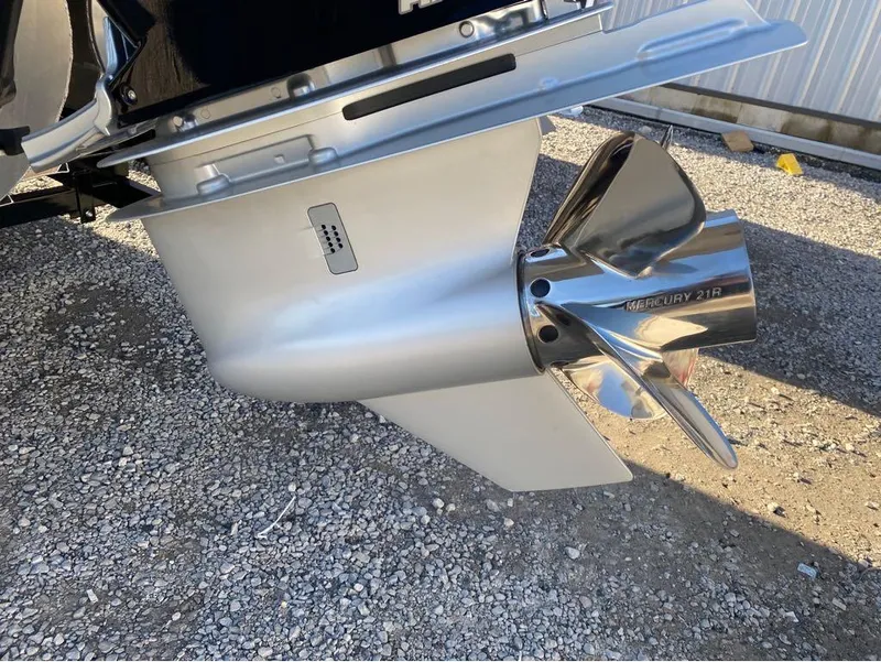 Slide: The Image of 2024 Trifecta 23 RFS 3.0 boat propeller, Mercury 21R, on gravel surface. - 4