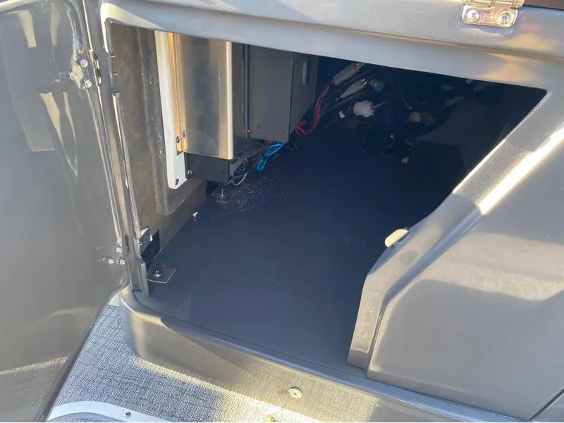 Slide: The Image of Open storage compartment of 2024 Trifecta 23 RFS 3.0 boat, showing interior details. - 6