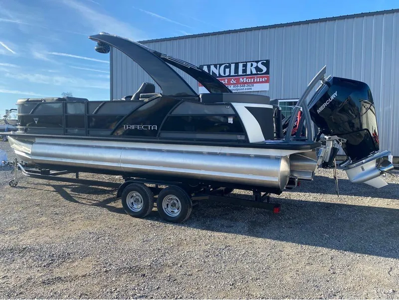 Slide: The Image of 2024 Trifecta 23 RFS 3.0 pontoon boat on trailer, displayed outdoors. - 8