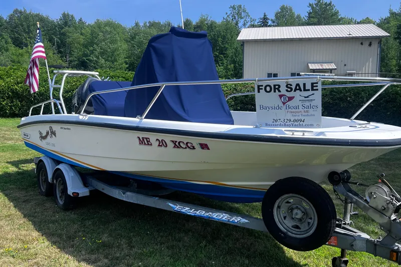 Slide: The Image of 2009 Boston Whaler 200 Dauntless boat for sale on trailer, displayed outdoors. - 18