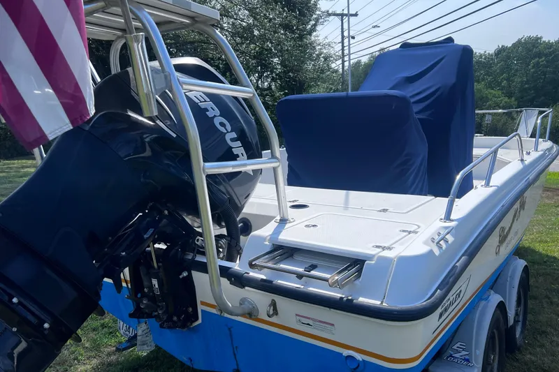 Slide: The Image of 2009 Boston Whaler 200 Dauntless boat with Mercury engine on trailer. - 21