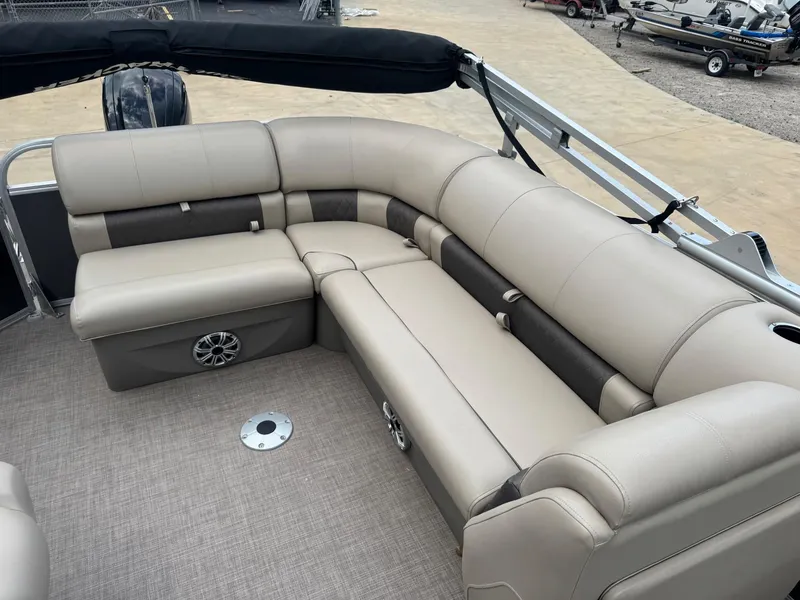 Slide: The Image of 2023 Sun Tracker Party Barge 20 DLX with beige seating and spacious layout. - 4