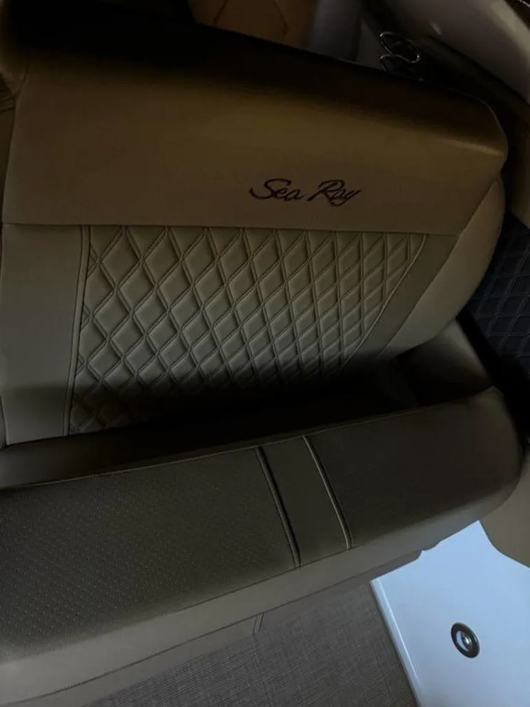 Slide: The Image of 2023 Sea Ray SLX 350 boat seat with diamond-patterned upholstery. - 4