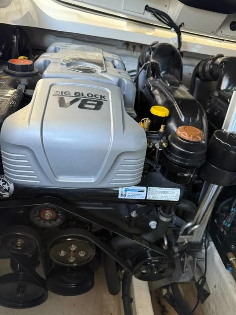 Slide: The Image of 2023 Sea Ray SLX 350 engine compartment featuring a Big Block V8 engine. - 9