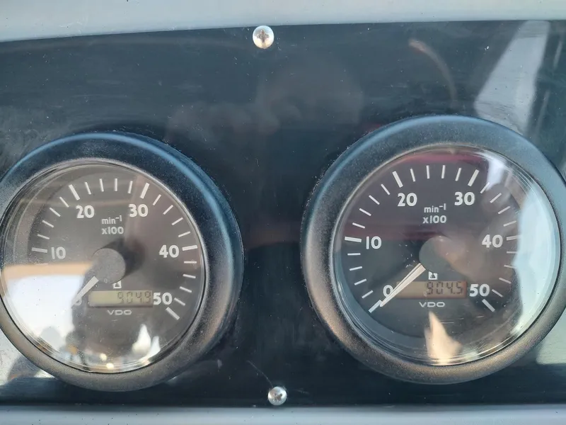 Slide: The Image of Dashboard gauges of a 1994 Tiara Yachts 3100 Open boat. - 16