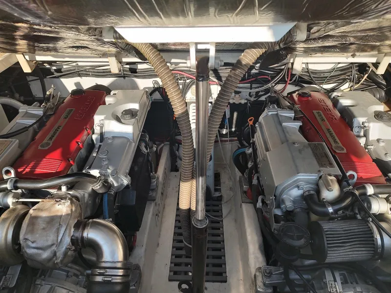 Slide: The Image of Engine compartment of a 1994 Tiara Yachts 3100 Open, showcasing dual engines. - 4