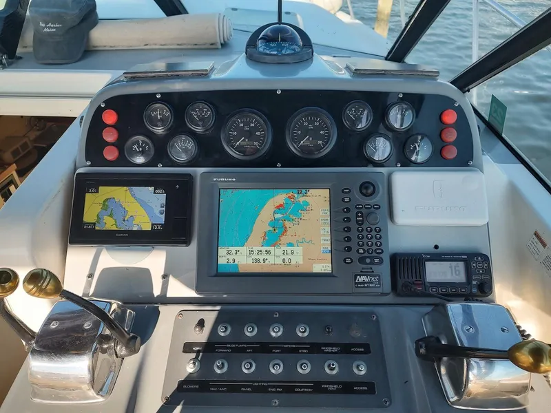 Slide: The Image of 1994 Tiara Yachts 3100 Open dashboard with navigation and control instruments. - 7