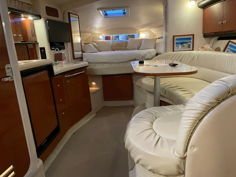 Slide: The Image of Luxurious interior of 2002 Sea Ray 340 Sundancer yacht with cozy seating and elegant design. - 16
