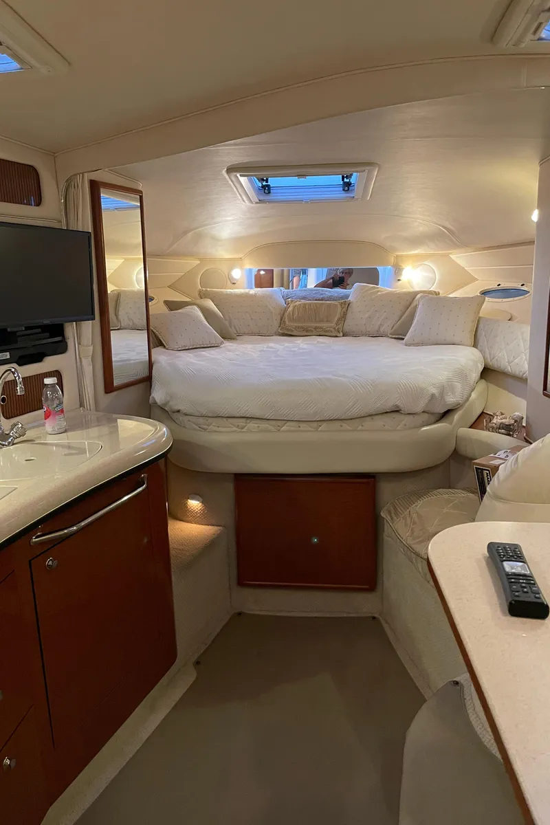 Slide: The Image of Interior of 2002 Sea Ray 340 Sundancer yacht, featuring cozy cabin and modern amenities. - 19