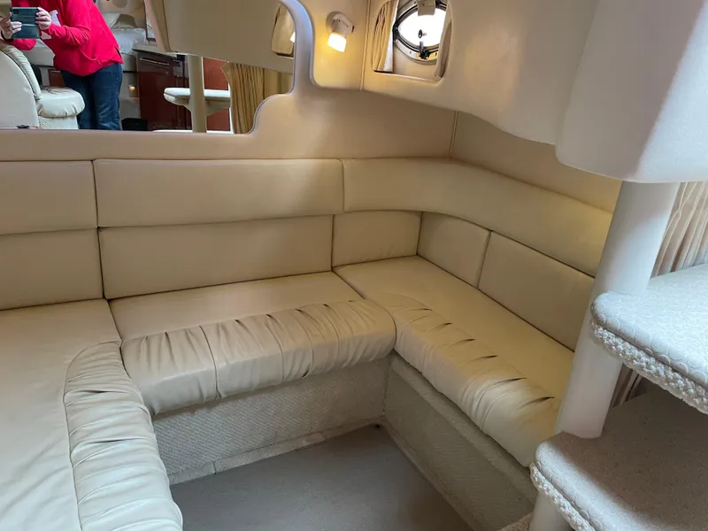 Slide: The Image of Interior of 2002 Sea Ray 340 Sundancer with beige leather seating and soft lighting. - 20