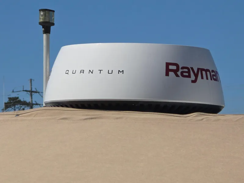 Slide: The Image of Radar system on a 2002 Sea Ray 340 Sundancer boat under clear blue sky. - 25